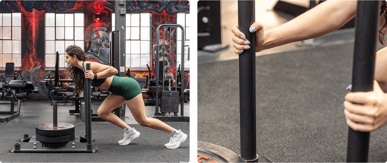 Woman performing a sled push exercise in a gym.
